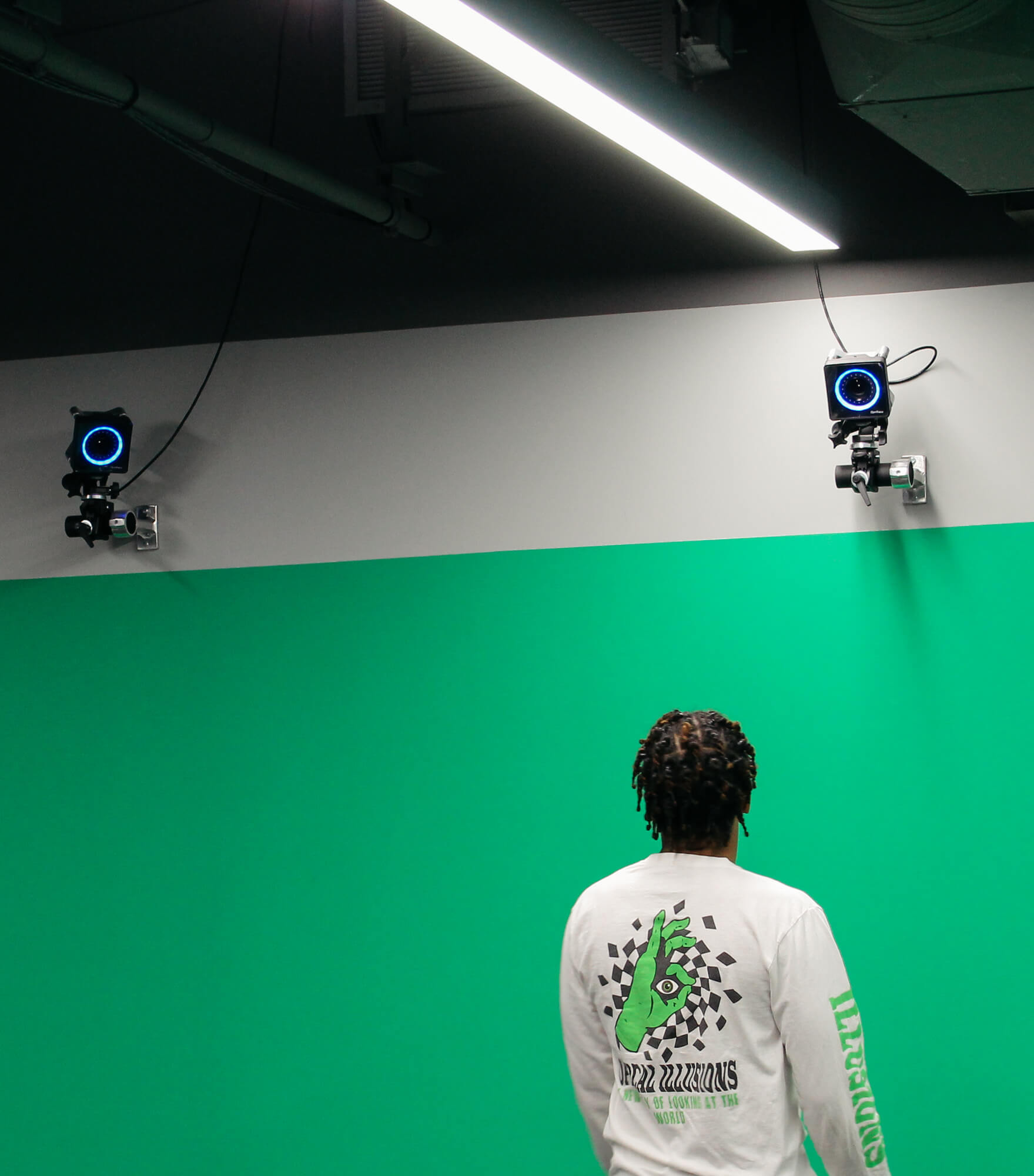 Student using the CoLab green screen